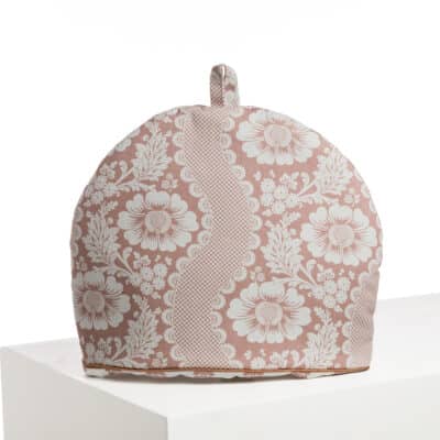 CACHE THEIERE "FLEURS STYLISEES SUR MONTANTS ONDULANTS" ROSE POUDRE